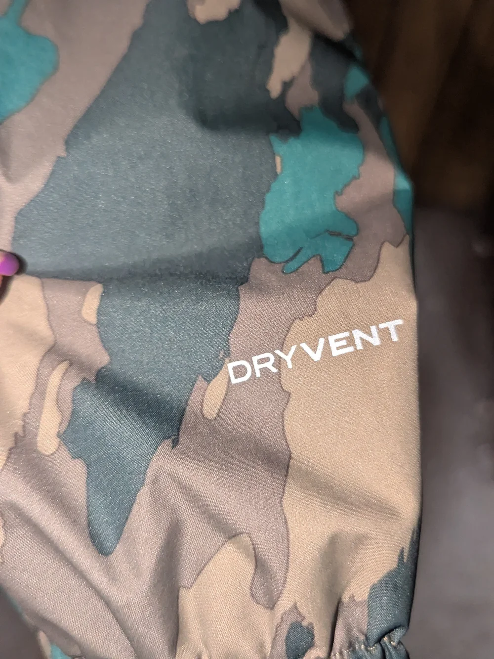 The North Face Kids Hooded Raincoat in Black and Green Camo